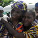 A woman embraces a relative, one of the released schoolgirls kidnapped by Boko Haram, in Abuja, Nigeria, on May 20, 2017. (Olamikan Gbemiga/AP Images)
